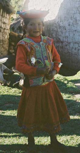 A little girl in the village in her best dress.